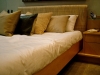 bed-with-lots-of-cushions_0